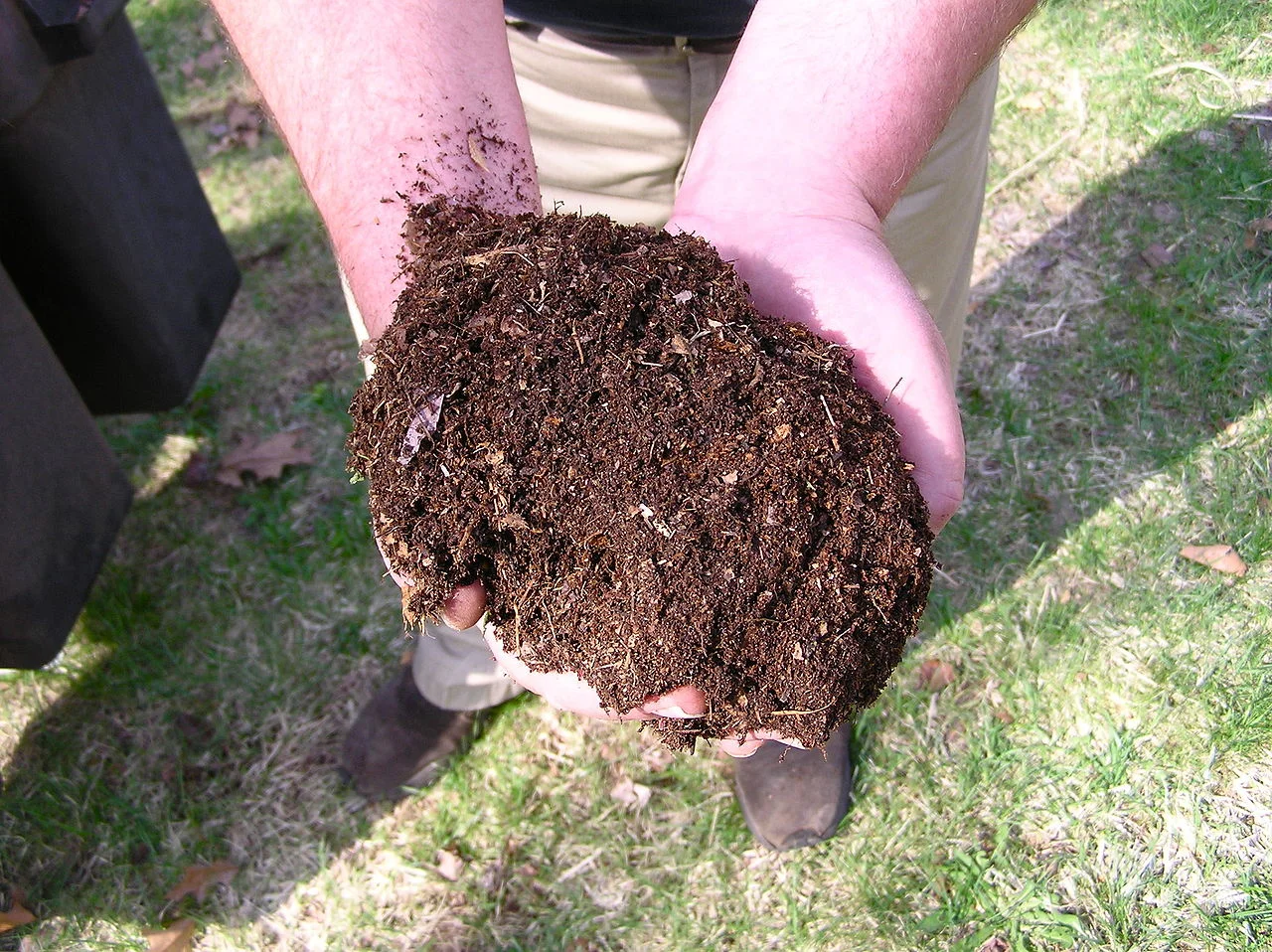 home compost pile in garden