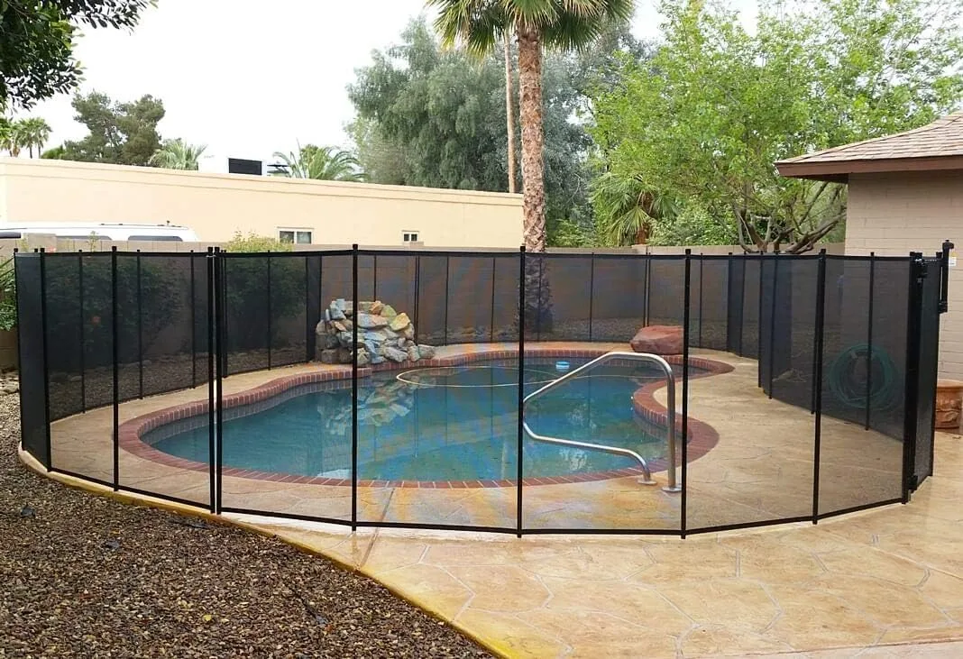 VINGLI black mesh safety fence installed around an inground swimming pool